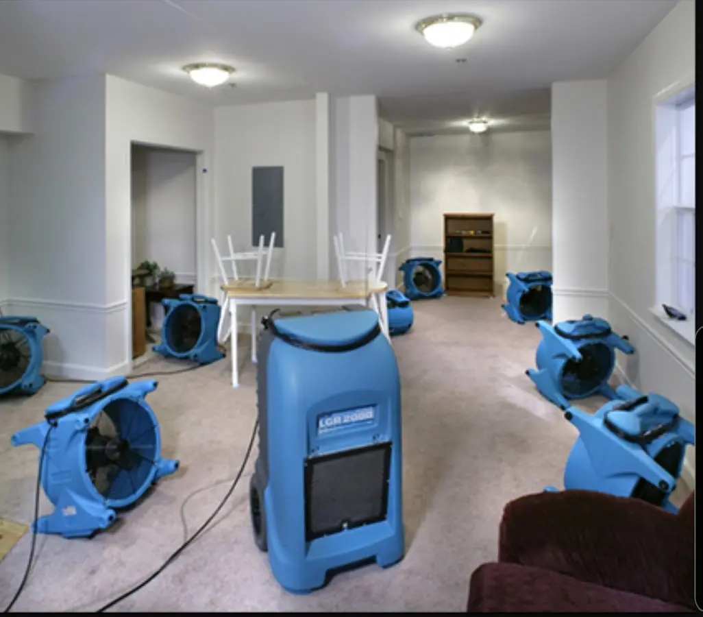 Air movers and dehumidifier setup for Water Damage Restoration in Hingham